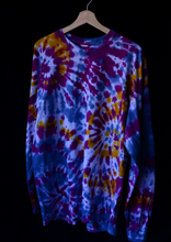 Load image into Gallery viewer, Tie dye shirt with multiple spirals. Colors are deep purple and yellow with a lighter blue.
